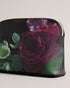 PAPION-Gifts-Pretty on your shelf and just as handy, the PAPION makeup bag is crafted from luxurious faux leather and adorned with a captivating floral print. Its convenient zip fastening ensures your favorites are securely tucked away, while the debossed logo completes the look. Makeup bag Faux leather Floral print Zip fastening Debossed logo Dimensions: 7cm x 14cm x 20cm- Ted Baker Romania